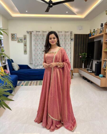 Rust Anarkali with intricate embroidery paired with a Dupptta